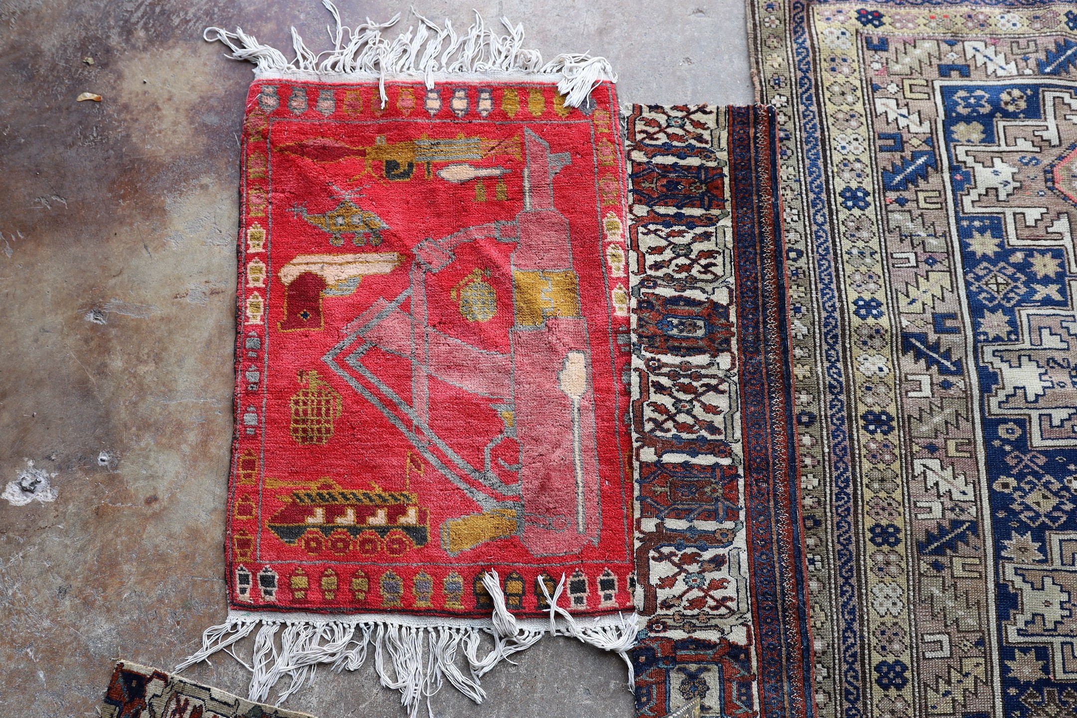 An antique Caucasian Derbend rug, 160 x 108cm, a smaller red ground rug and rug fragments